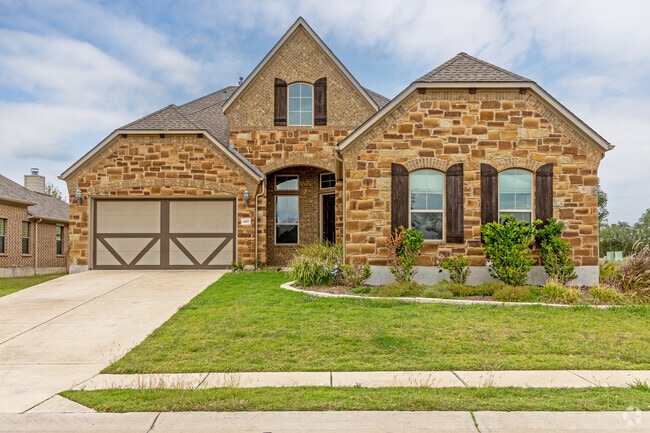 Some areas of River Bend have large homes with steep gabled roofs.