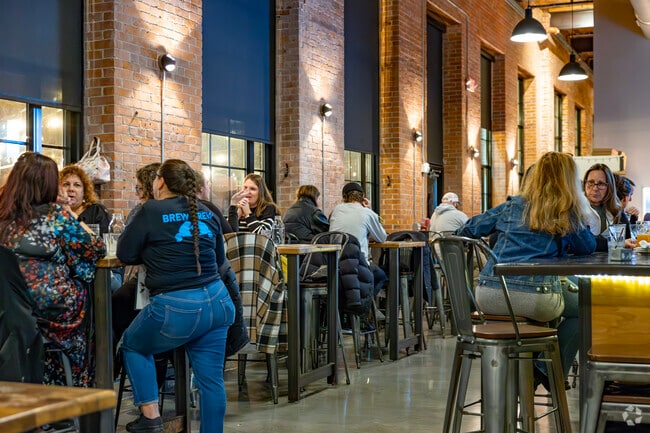 Friends gather after work for an evening of fun at Natick's Apponaug Brewery.