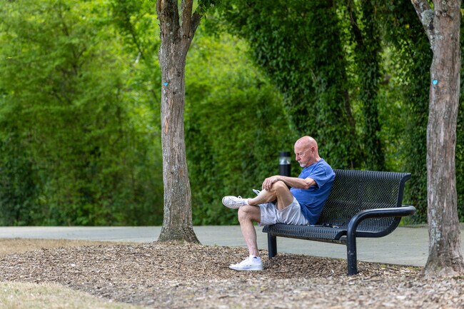 Visitors admire the serene Horseshoe Bend at Riverside Park in Roswell.