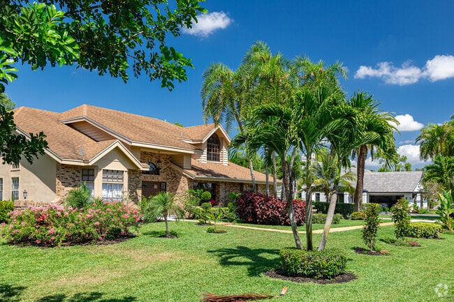 Quail Creek features homes of a variety of custom styles with manicured lawns.
