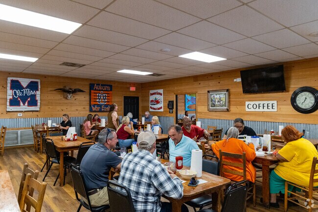 David’s Catfish House welcomes guests with SEC décor, wooden tables, and a warm, casual vibe