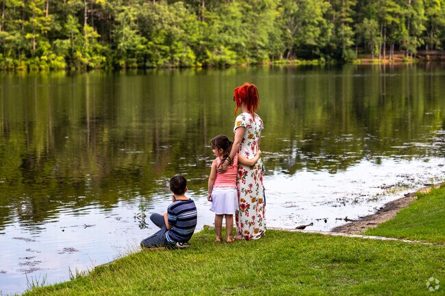 Families relax by the lake at Sesquicentennial State Park in Northeast Columbia.