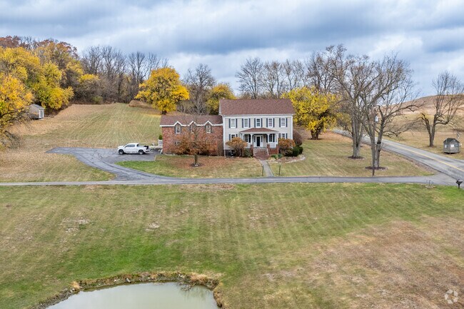 Colonial-style houses sit on large plots in the hills of Smith Township.