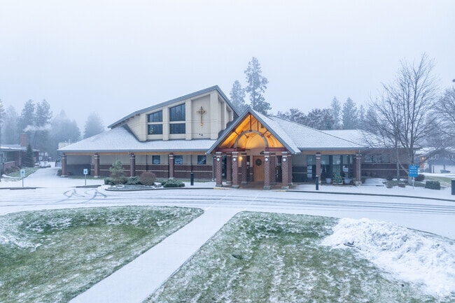 All Saints school features parking lot for visitors.