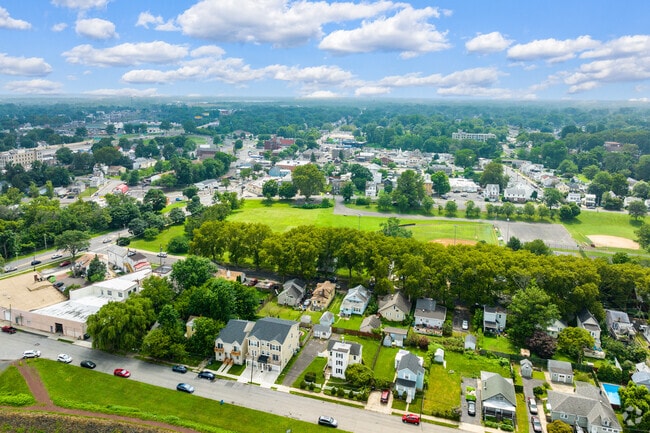 Homes near Falls Township line tree‑shaded streets by shopping and dining.
