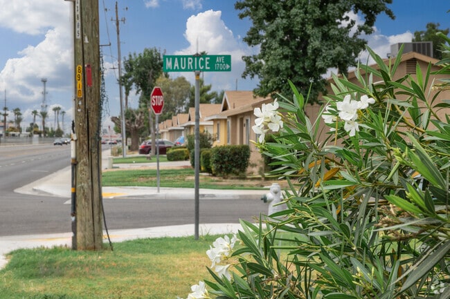 Flowers grow along the side of the road in South Wible Orchard.