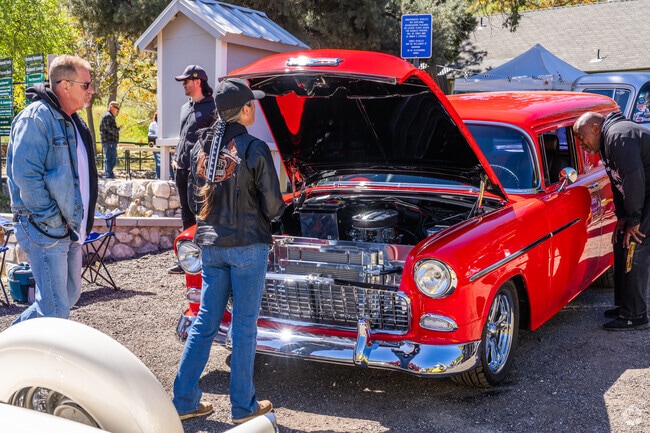 A number of guests check out this red hot rod at the Lake Hughes Canyon Run Car Show.