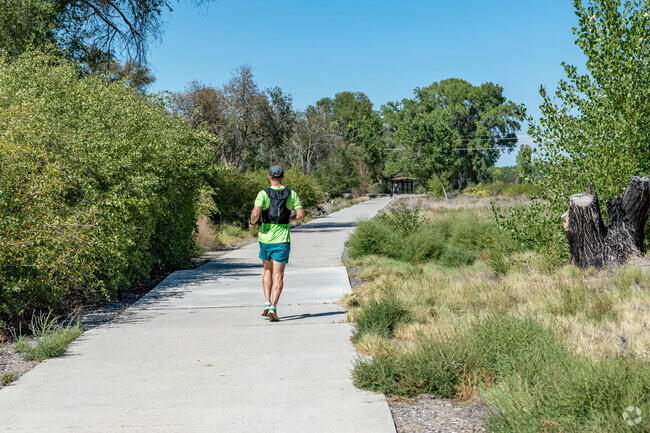 Locals walk and jog the paths at James M. Robb Park - Connected Lakes Section.