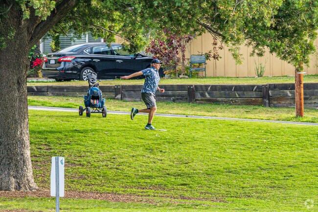 A frisbee golfer teeing off at the La Mirada Aquatic Center's frisbee golf course.