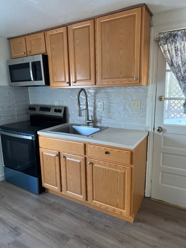 Kitchen with Stove Top Range & Microwave above