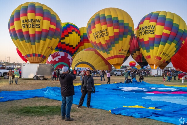 Crowds gather near Tuscany for Albuquerque’s annual Balloon Fiesta in the crisp autumn air.