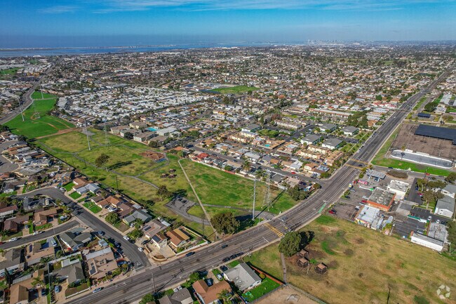 Castle Park shows the long open field and the nearby neighborhood homes.