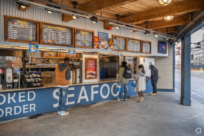 Tourists commonly order food at Ivar's seafood restaurant in Downtown Seattle.