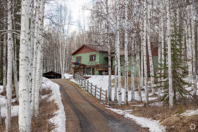 Wooded driveways lead to rustic cabins in the serene College neighborhood.
