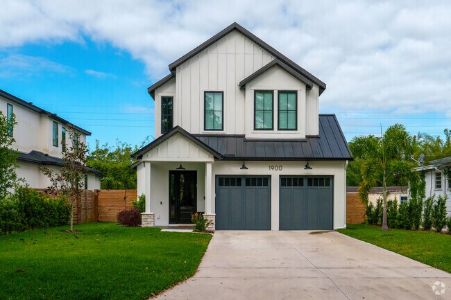 This large new construction home exhibits beautiful charm and exterior in Audubon Park.