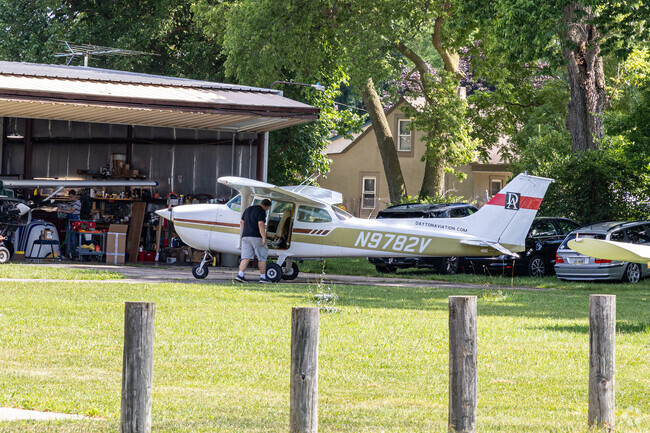 Owners take care and clean their personal planes in the West Carrollton neighborhood.