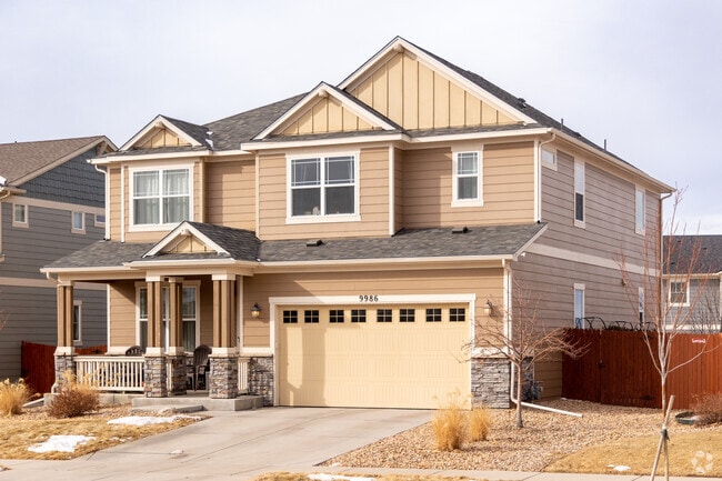 This craftsman home in Sierra Ridge features a covered porch and a fenced back yard.