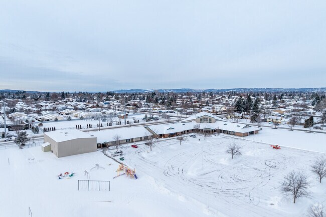 Spokane Valley Adventist School features a long single story buildung.