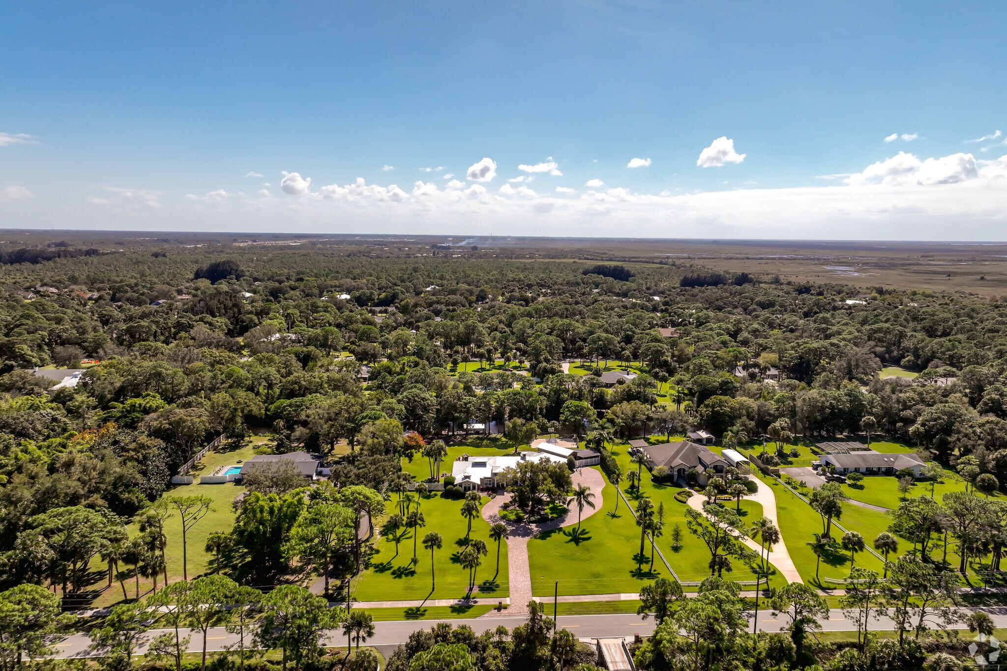 An aerial view of a modern but rural neighborhood in River Lakes.