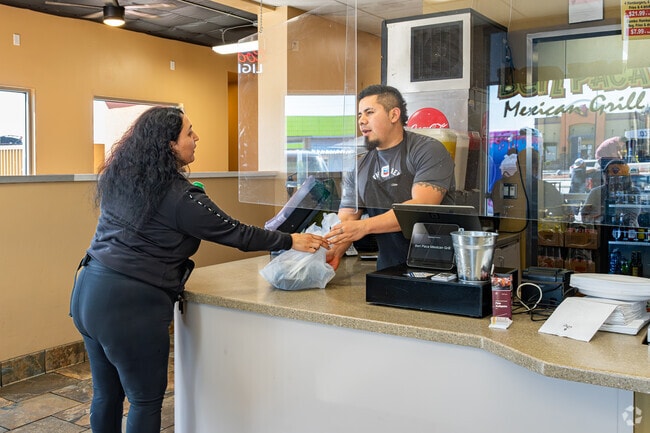 A Tyner resident picks up her lunch order at Ben Paca Mexican Grill.