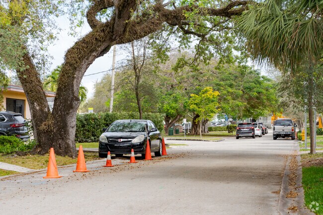 Golden Gate residents use cones to direct the flow of traffic during school hours.