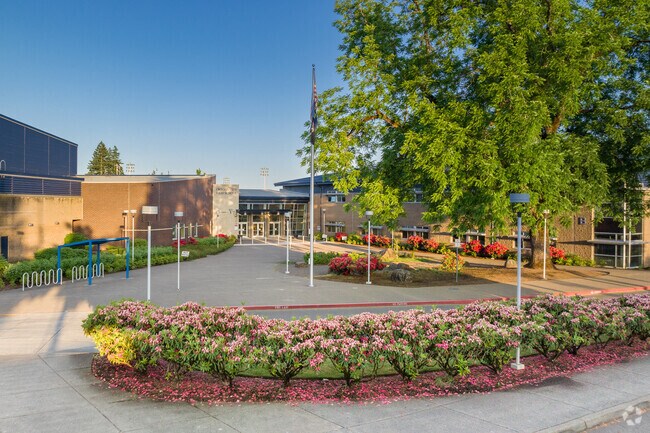 Flowering bushes in front of the Oregon City Highschool entrance in the Caufield Neighborhood.
