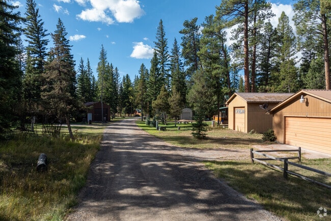 Tree-lined streets in Lincoln feature neat homes with mountain backdrops.