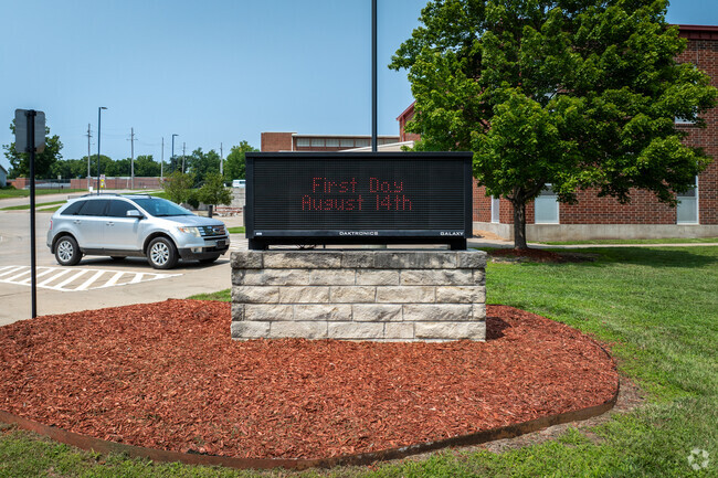 Wamego High School has a sign near the main road.