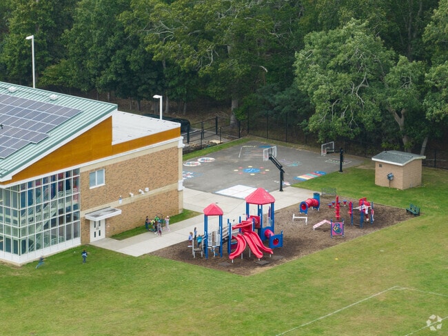 Kids love the playground behind Tuttle Avenue School.