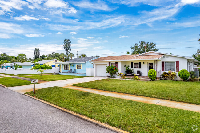 Cute small beach homes are mixed with ranch style homes throughout St.Pete Beach neighborhood.