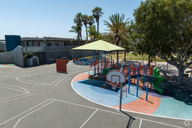 playground zoom out with basketball courts.