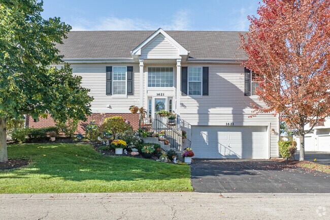 Residents in Remington Trails decorate porches with seasonal flowers and personal touches.