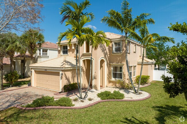 Beautiful Mediterranean-style villa with palm trees in Miramar.