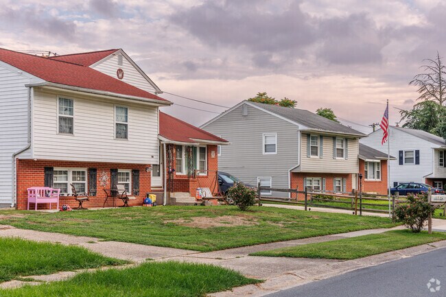 Larger brick and vinyl-sided split level homes with yards are spread throughout Rodney Village.