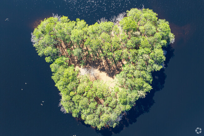 Pine Lake Park features a small heart shaped island in the middle of Pine Lake, making it a scenic and recognizable landmark in the area.