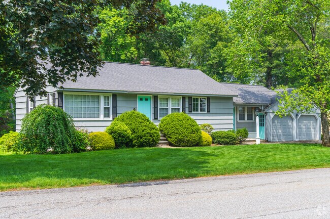 Ranch homes with large windows and colorful surroundings are common in West Chelmsford.