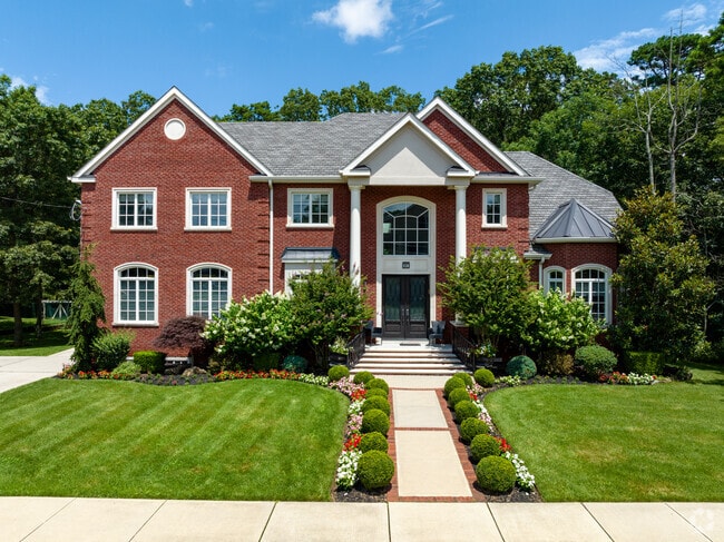 Some larger colonial-style homes dot the streets in Lakewood.