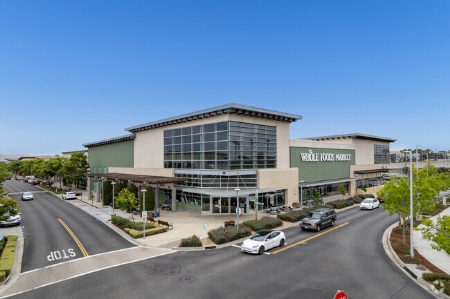 Locals in Rose Park grab their groceries from Whole Foods Market at The Collection.