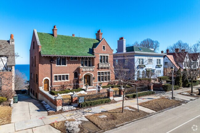 Large grand homes in Shorewood sit along the Lake Michigan coastline.