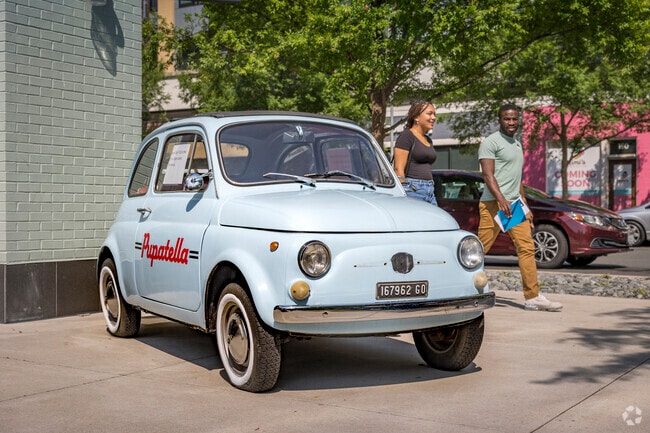 Merrifield has a charm all its own, shown by a vintage car outside Pupatella.