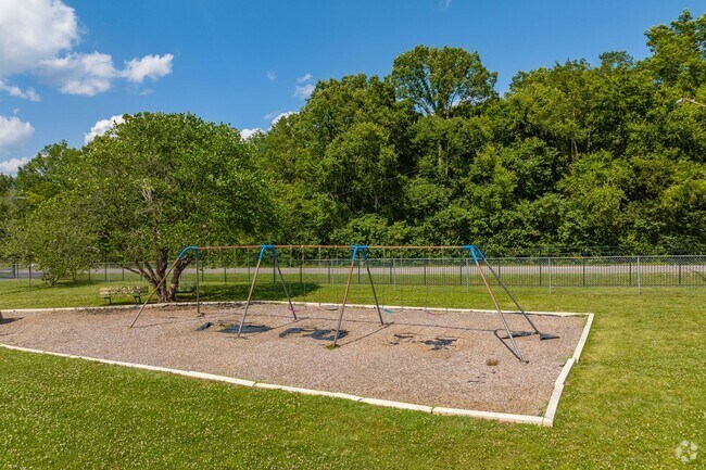 St. Pius X Classical Academy in Haynes Area has a swing set and benches for recess fun.