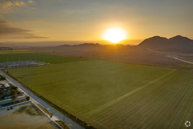 In Lakeview, the sun sets over farmland in the outer San Jacinto area.