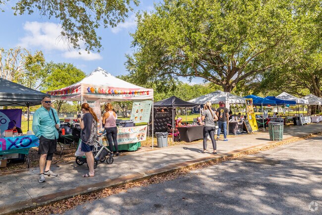 Visit the weekly farmers market in Coral Reef Park while living in Palmetto Bay, FL.