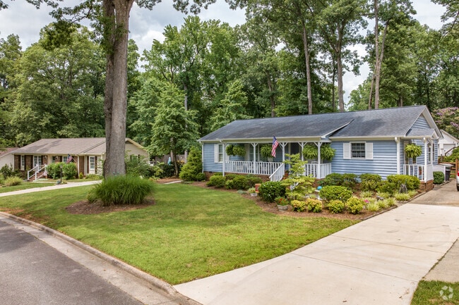 A ranch home in The Thicket features a large front porch.