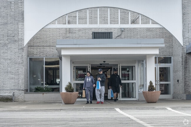 Shoppers leave the Auburn Mall.