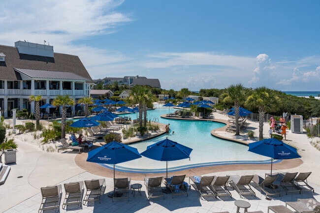 The beach club at Watersound offers a pool with a lazy river and private beach access.