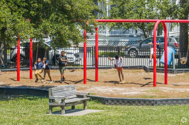 Friends play at one of the many parks found at East End Historic District.