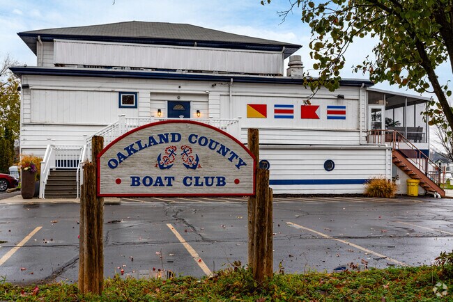 Members dock boats at Oakland County Boat Club on Sylvan Lake.