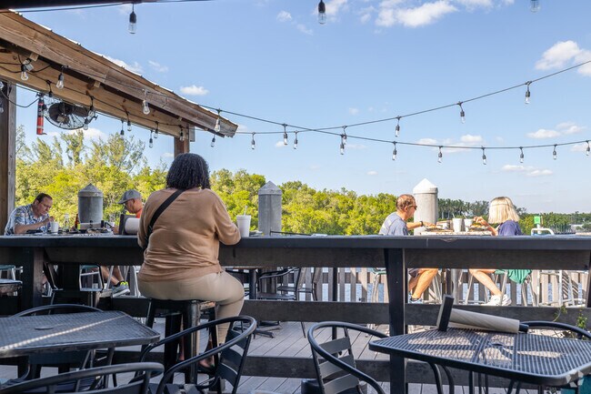 Camellia Street Grill serves stone crab and seafood on a waterfront patio.