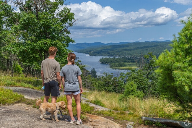 Explore challenging trails and scenic views on the Brant Lake Bike Park Trail.